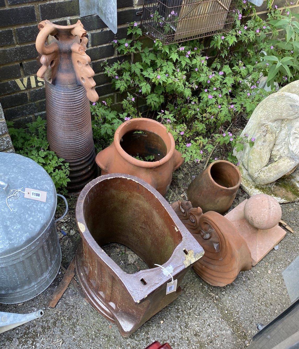 Six assorted terracotta and earthenware planters and ornaments *Please note the sale commences at 9am.